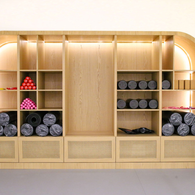 In the dance studio, there are various exercise props, mats, weights, resistance bands, and other equipment.