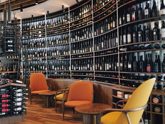 Interior of the Decanter wine shop with seats for wine tasting in Belgrade Waterfront