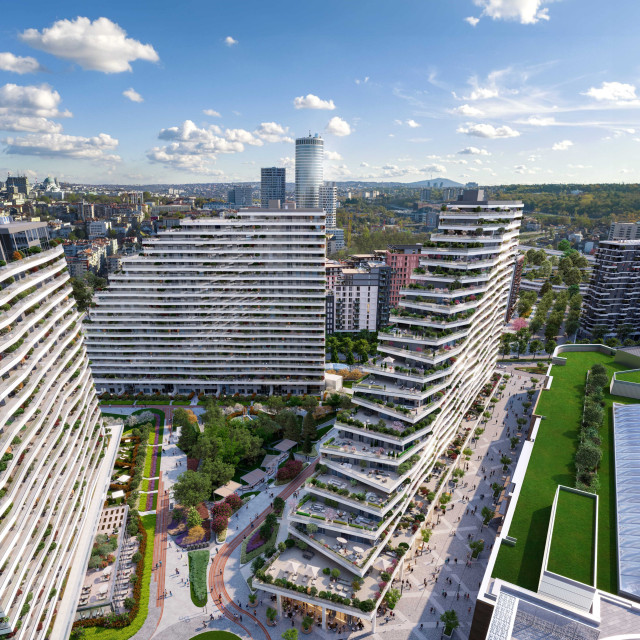 The BW Dolce building and its spacious courtyard with lush greenery and flowers